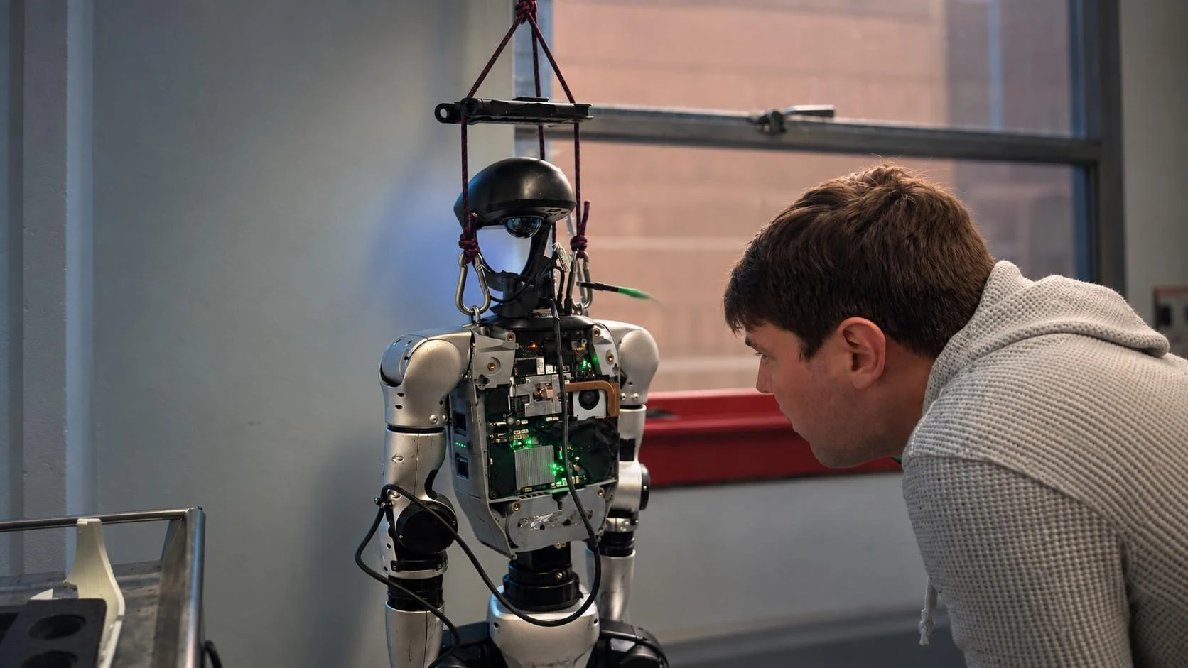 A Unitree G1 humanoid running Admiral in the lab